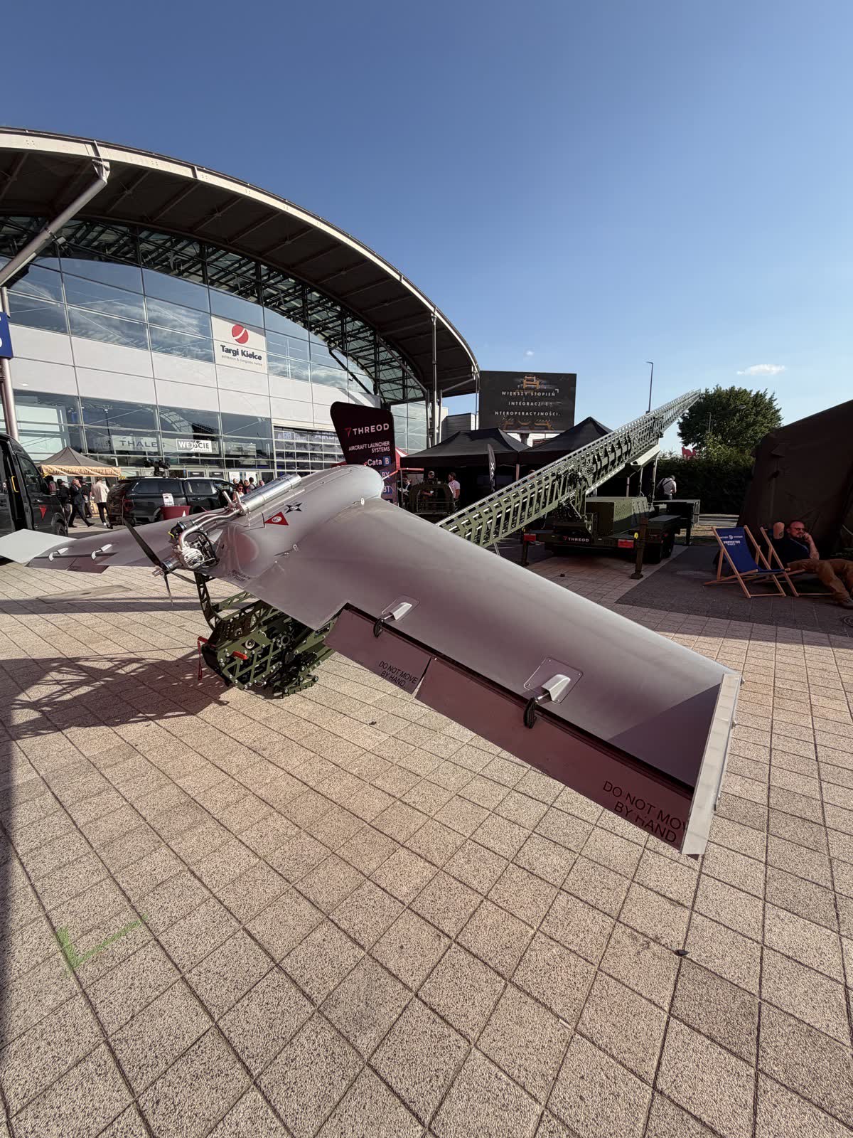 Threod Systems fixed-wing UAV on a launcher outside the hall